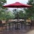 Flash Furniture XU-DG-304860064-UB19BRD-GG 30" x 48" Patio Dining Table, Red Umbrella, Base & 4 Synthetic Teak Stackable Chairs, 7 Piece Set addl-1