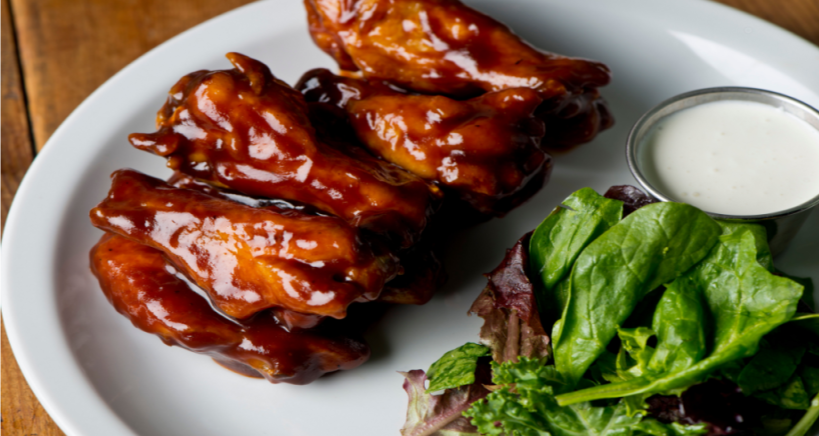 Hot honey wings with sriracha are the latest in trending condiment dishes.