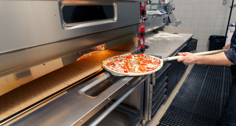 Commercial pizza ovens reach high temperatures to cook pizza to perfection.