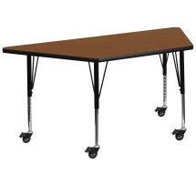 Flash Furniture XU-A2448-TRAP-OAK-H-P-CAS-GG Mobile 22.5''W x 45''L Trapezoid Oak Laminate Height Adjustable Activity Table, Short Legs