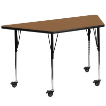 Flash Furniture XU-A3060-TRAP-OAK-T-A-CAS-GG Mobile 29''W x 57''L Trapezoid Oak Laminate Height Adjustable Activity Table